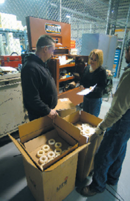 NortNorthwind employees inspect and prepare packaging for shipment to customer